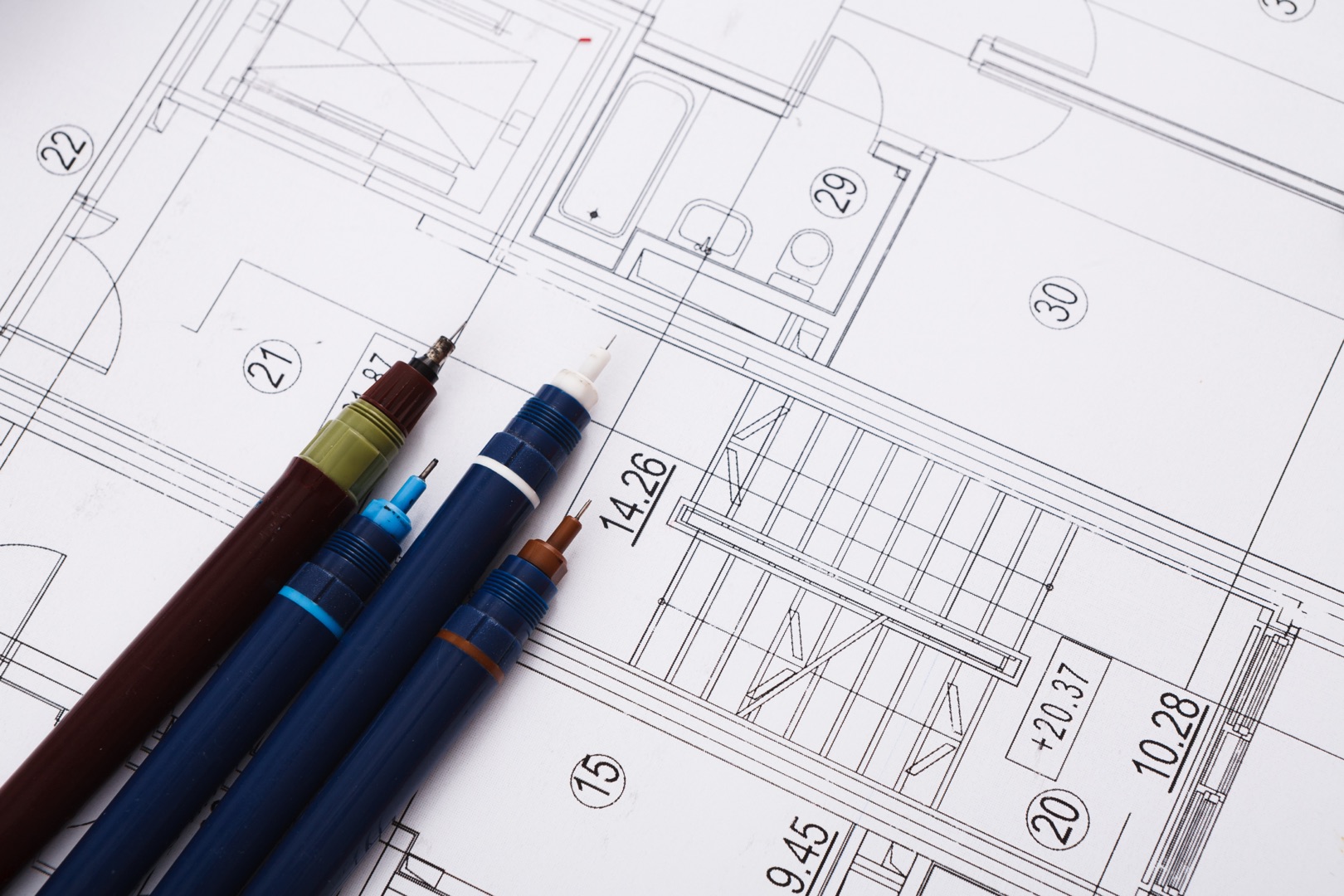 Ghost Drafters architectural project, engineering tools on table.